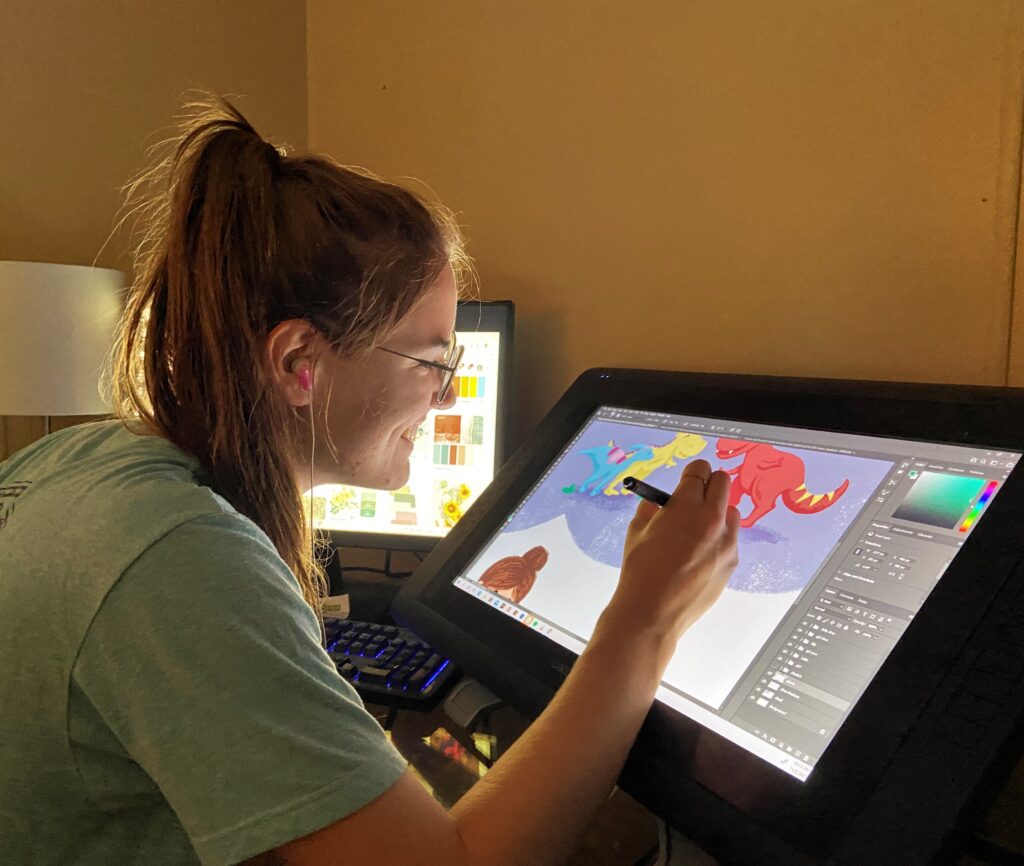 Caiti working on illustrations